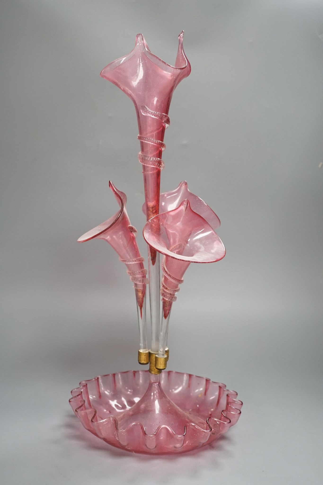 A Victorian cranberry glass four vase table centrepiece, 52 cms high.